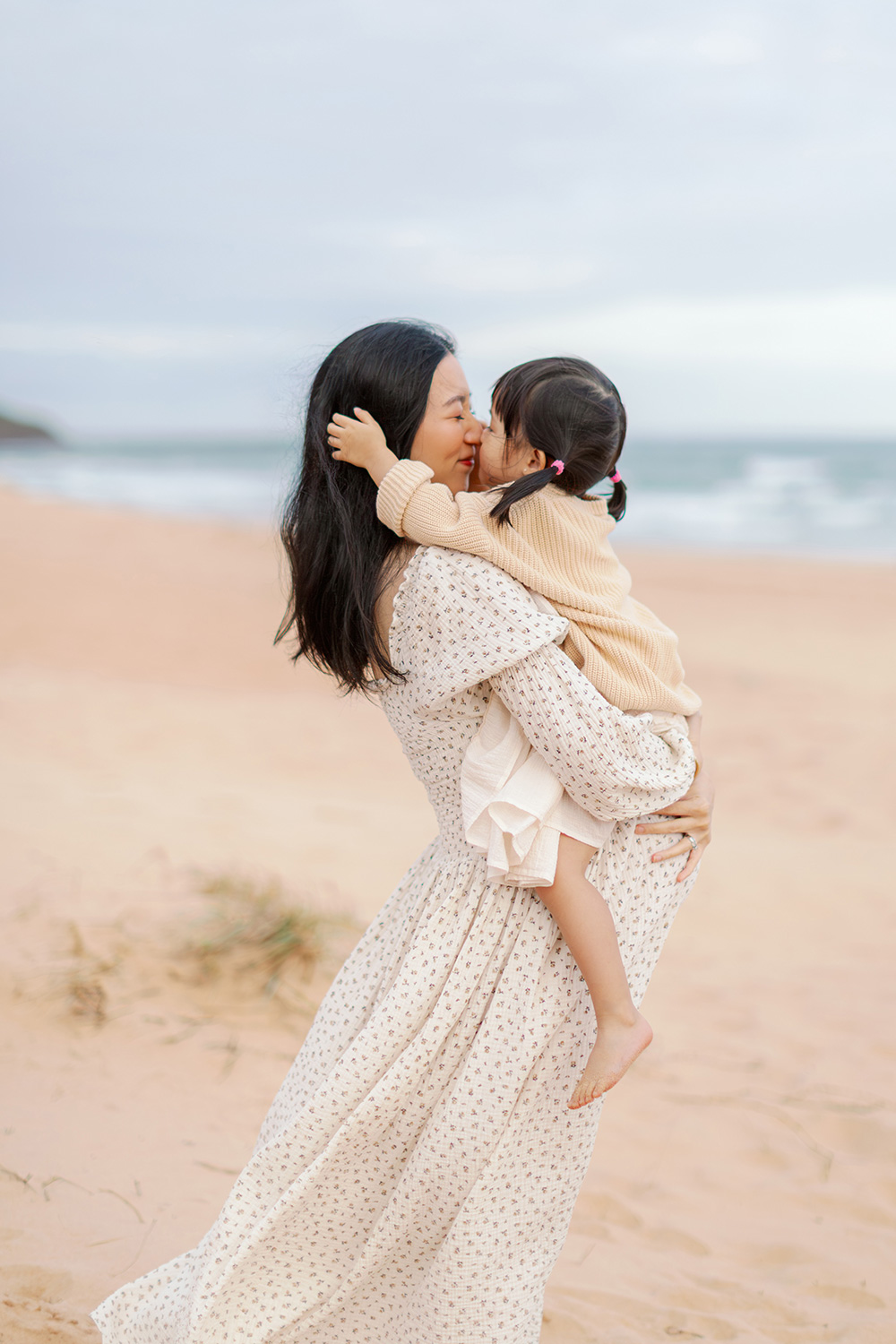 Pregnancy photography northen beaches with big sister hugging pregnant mother